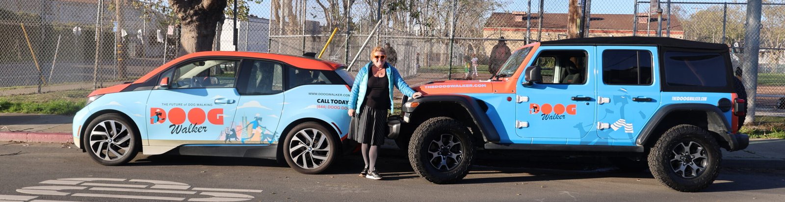 The Doog Walker branded vehicles parked in Marin County, showcasing our professional group dog walking service and safe transportation program.